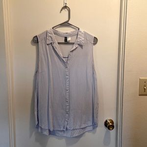 blue and white sleeveless blouse